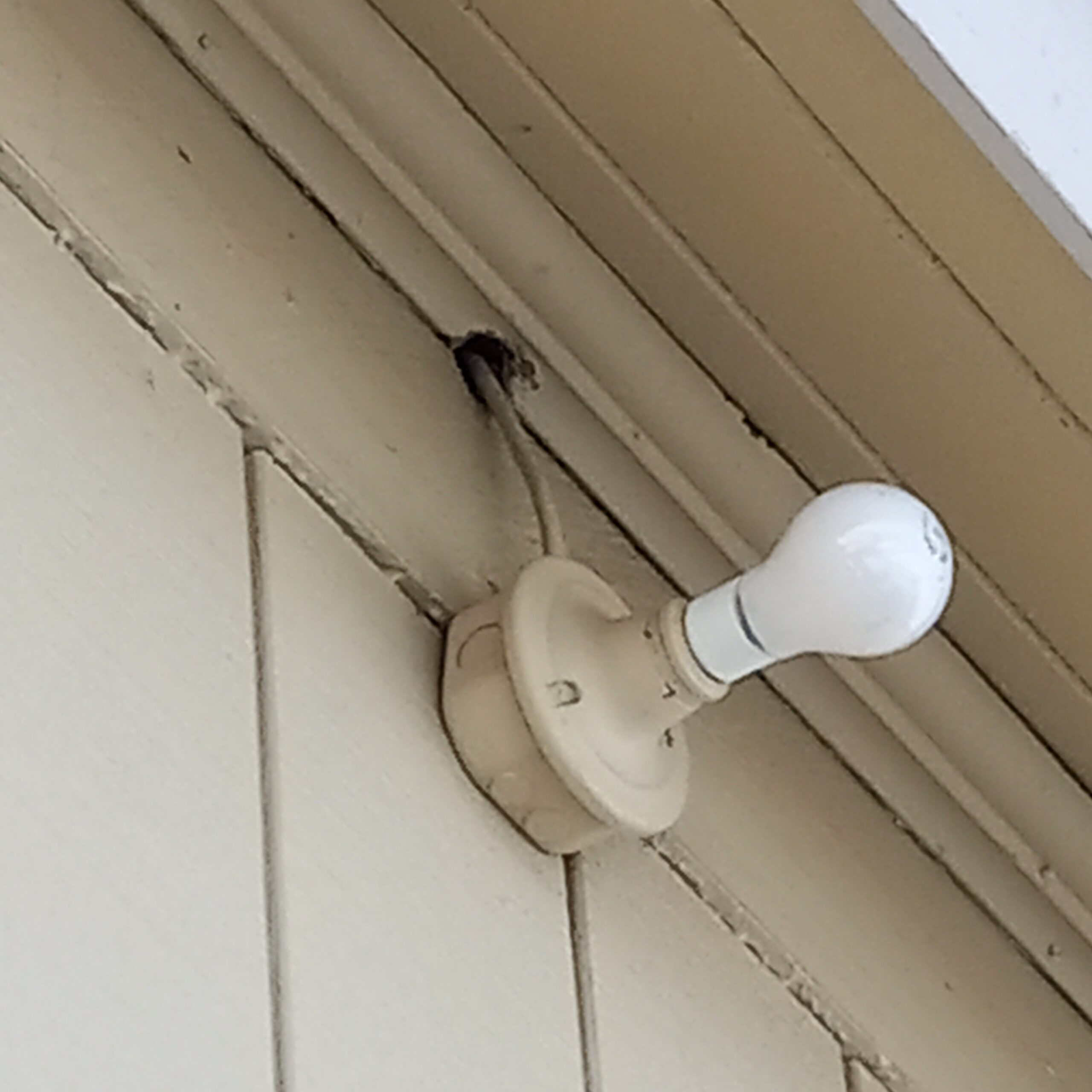 Existing light fixture and box are not rated for outside locations and wire is not protected